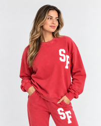 Woman wearing the SF Home Uniform crewneck in vintage red, front view